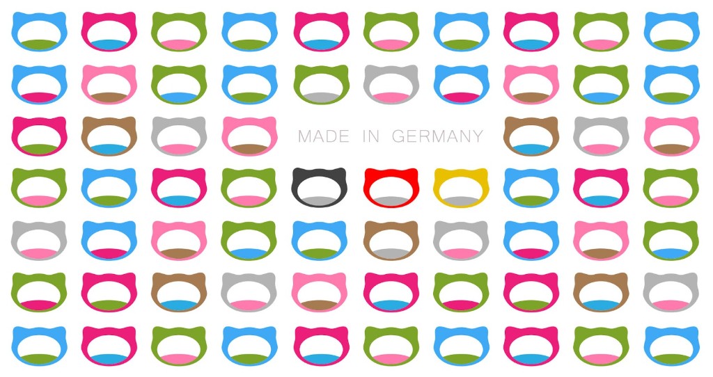 Grafik: bunte Katzen-Silhouetten, in der Mitte der Schriftzug Made in Germany